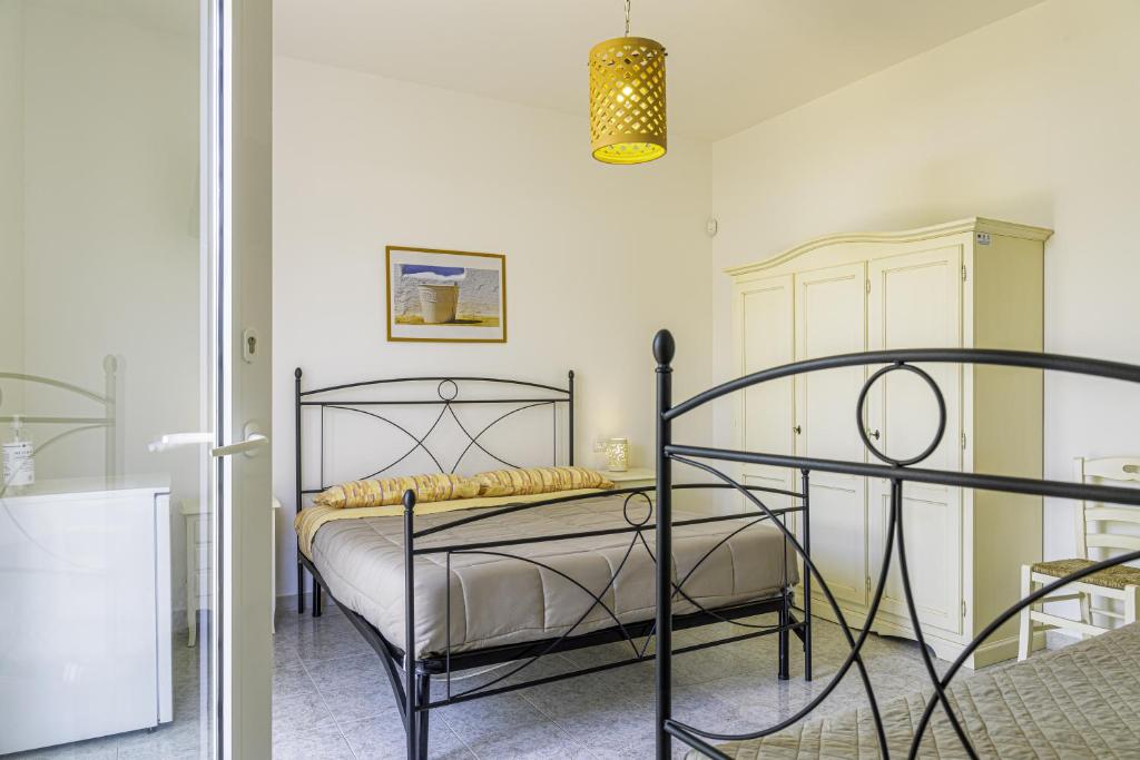 Łóżko lub łóżka w pokoju w obiekcie SalentOspita Guest Rooms
