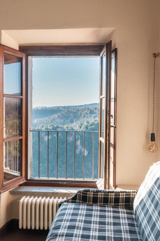 Postel nebo postele na pokoji v ubytování Hotel Della Fortezza