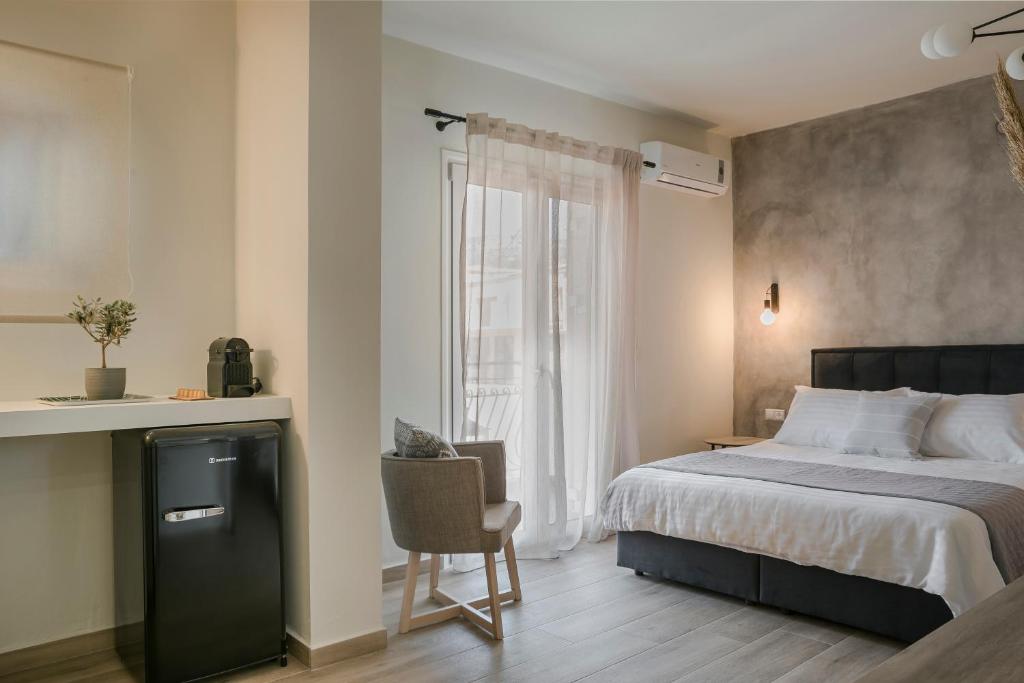 Postel nebo postele na pokoji v ubytování Socrates Apartments