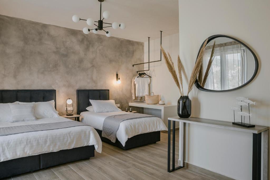 Postel nebo postele na pokoji v ubytování Socrates Apartments
