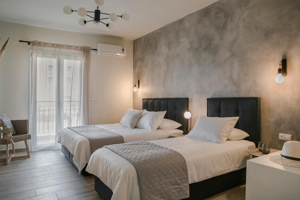 Postel nebo postele na pokoji v ubytování Socrates Apartments