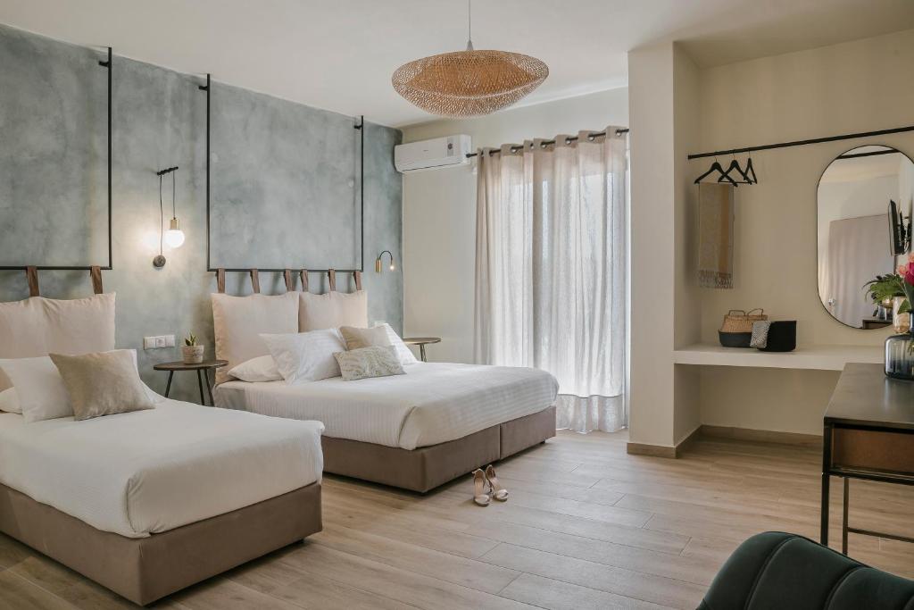 Postel nebo postele na pokoji v ubytování Socrates Apartments