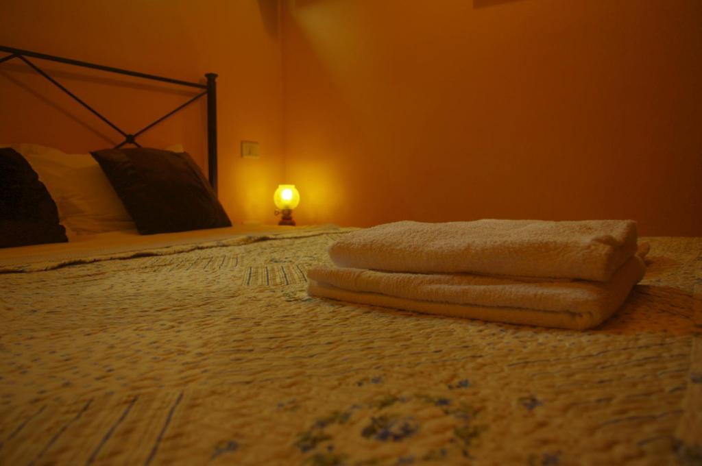Postel nebo postele na pokoji v ubytování CASA GIULIA - Residenza Lo Sparviero