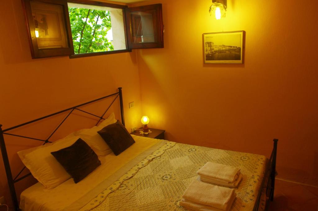 Postel nebo postele na pokoji v ubytování CASA GIULIA - Residenza Lo Sparviero