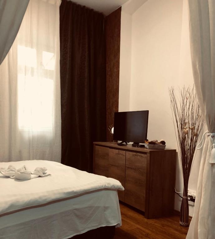 Postel nebo postele na pokoji v ubytování Luxury Apartments Zelny Trh 11