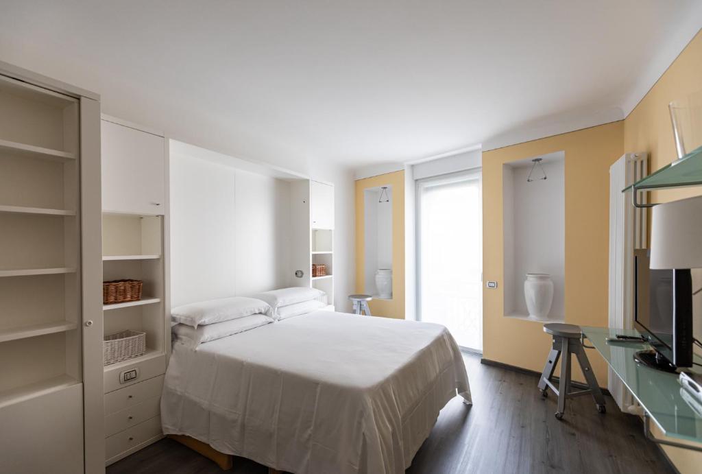 Postel nebo postele na pokoji v ubytování Stresa Residence