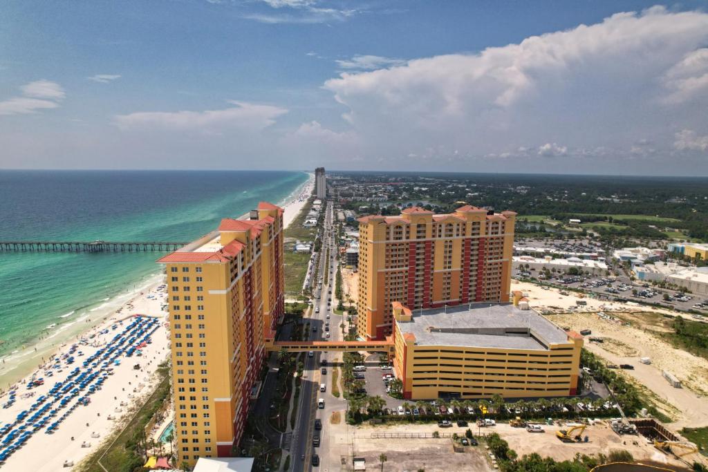 an aerial view of a beach with buildings and the ocean at Modern Beach Vibe with a Breathtaking View - Stunning Pool - Pier Park in Panama City Beach