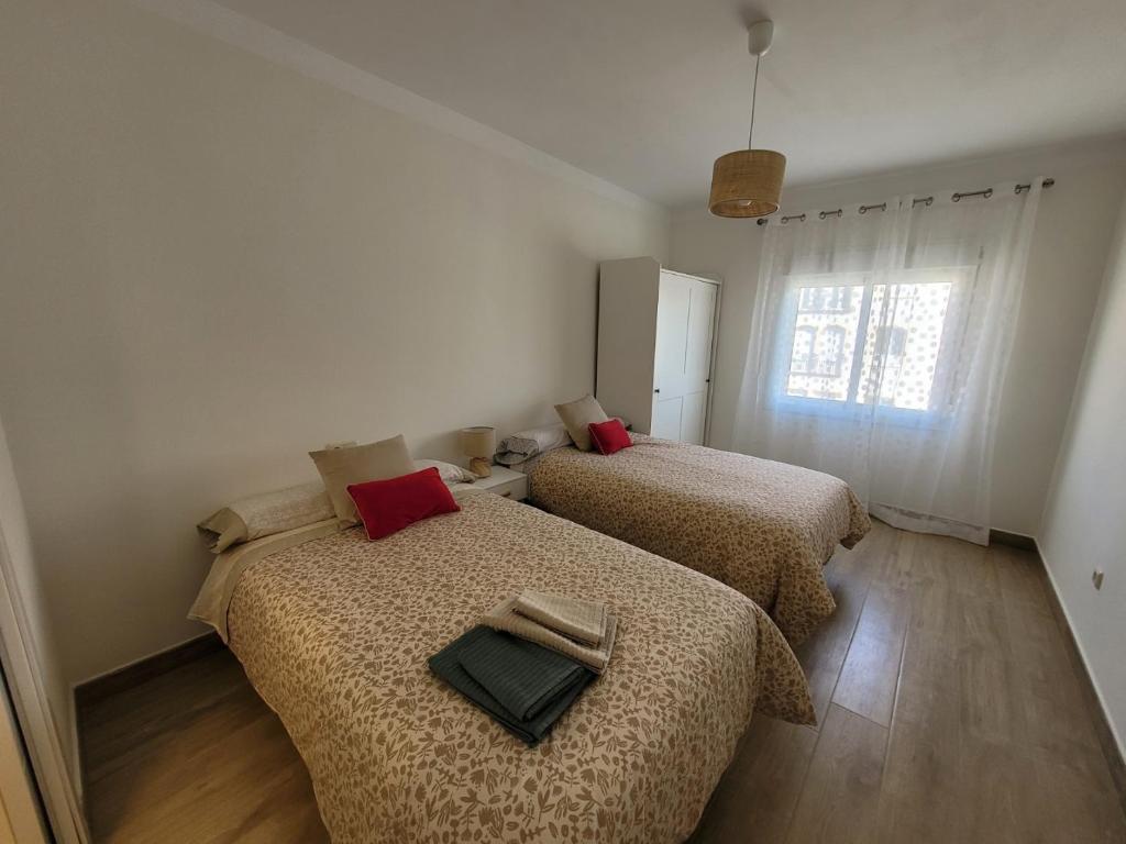 Postel nebo postele na pokoji v ubytování Marbella Centro