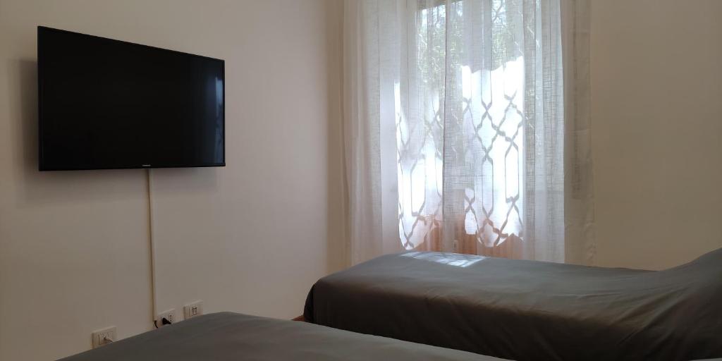 A bed or beds in a room at Terrazza di San Paolo