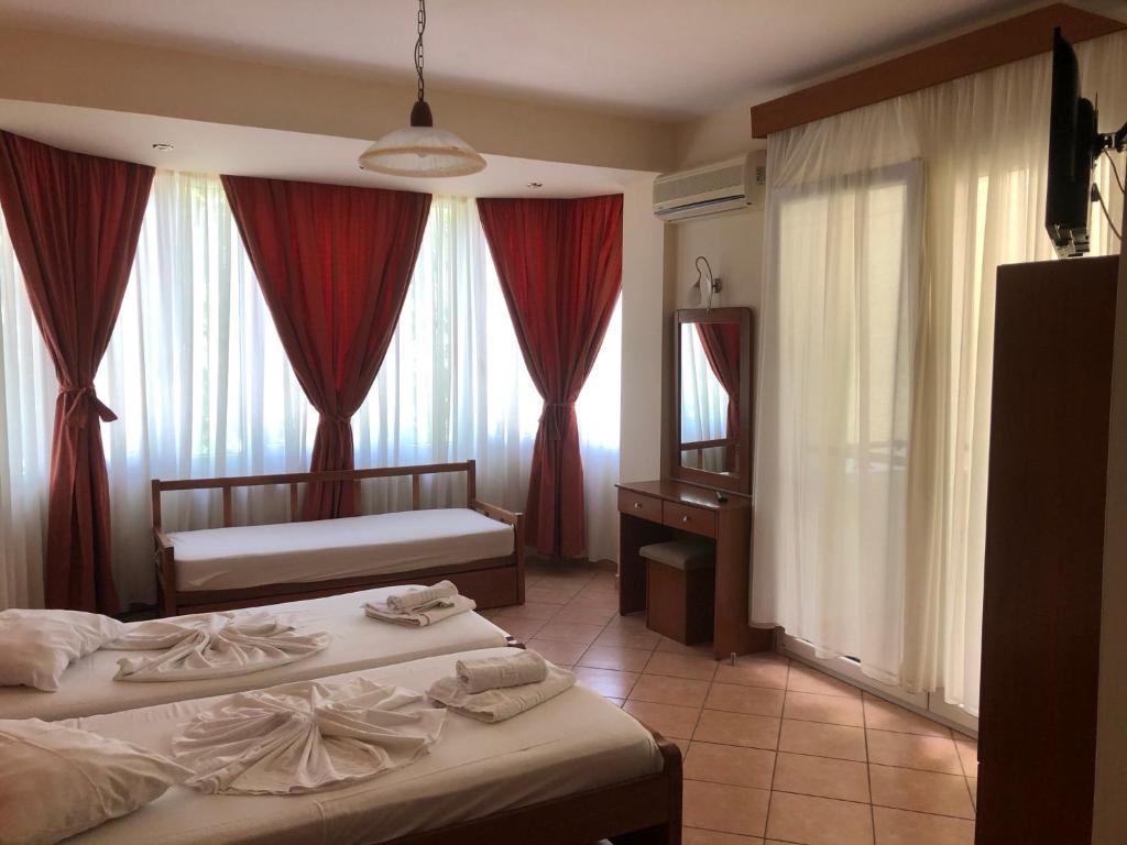A bed or beds in a room at Panos Studios