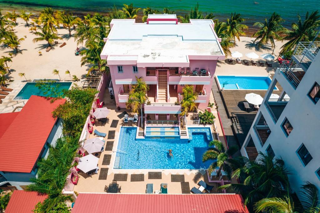 an aerial view of a resort with a swimming pool at Miramar Suites in Placencia