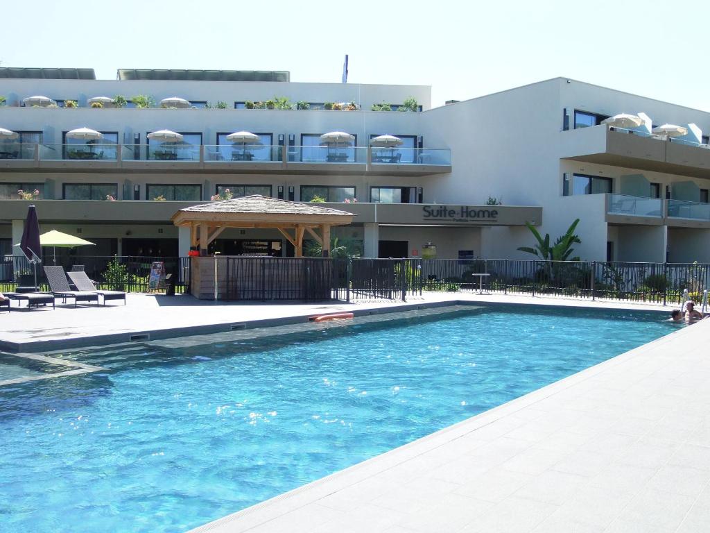 The swimming pool at or close to Suite Home Porticcio