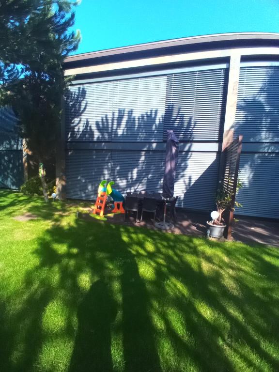 a shadow of a person standing in front of a trailer at Ocean Village 10 in Grândola