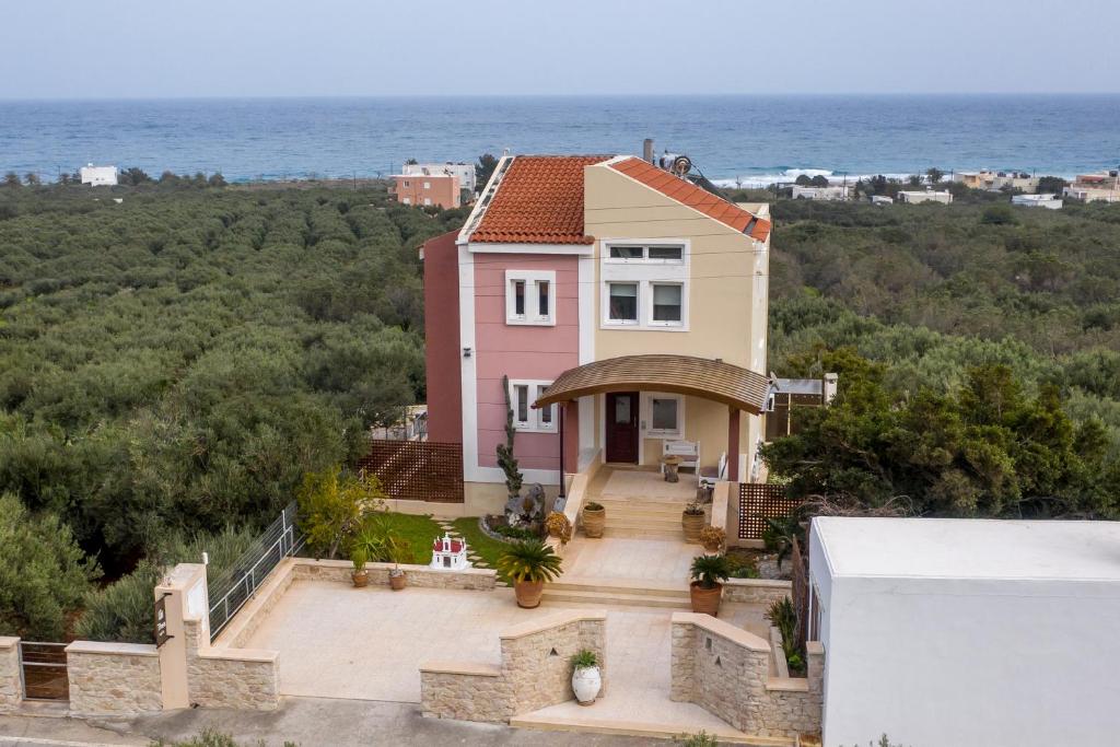 a house with a view of the ocean at Thea apartments in Xerokampos