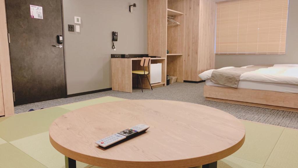 Postel nebo postele na pokoji v ubytování First Cabin Midosuji Namba