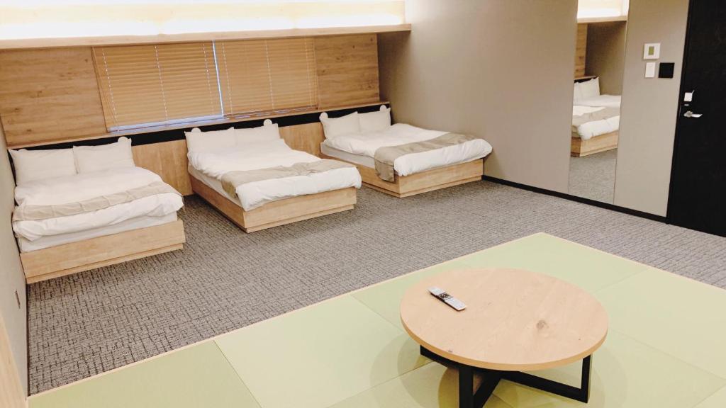 Posezení v ubytování First Cabin Midosuji Namba