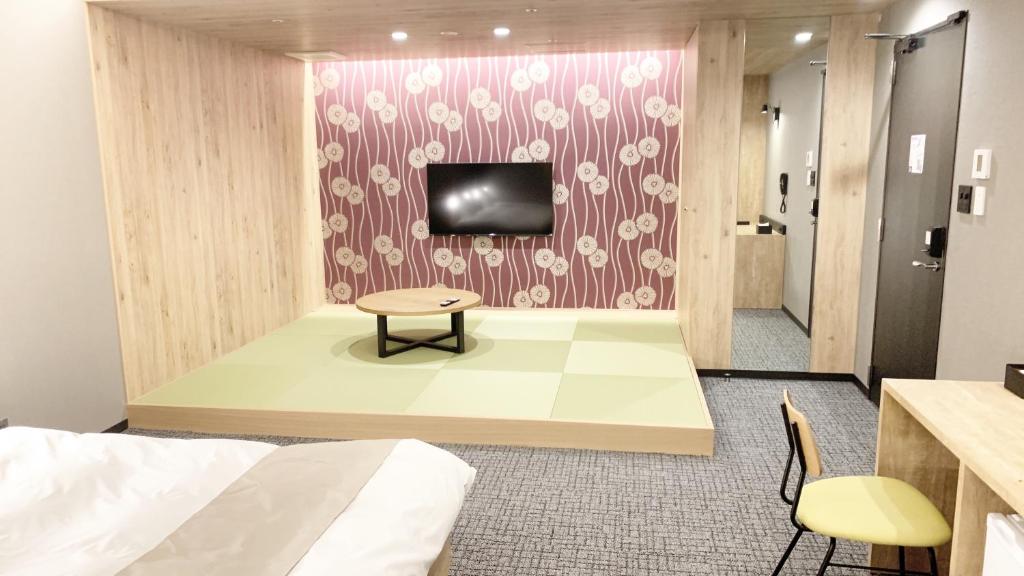 TV a/nebo společenská místnost v ubytování First Cabin Midosuji Namba
