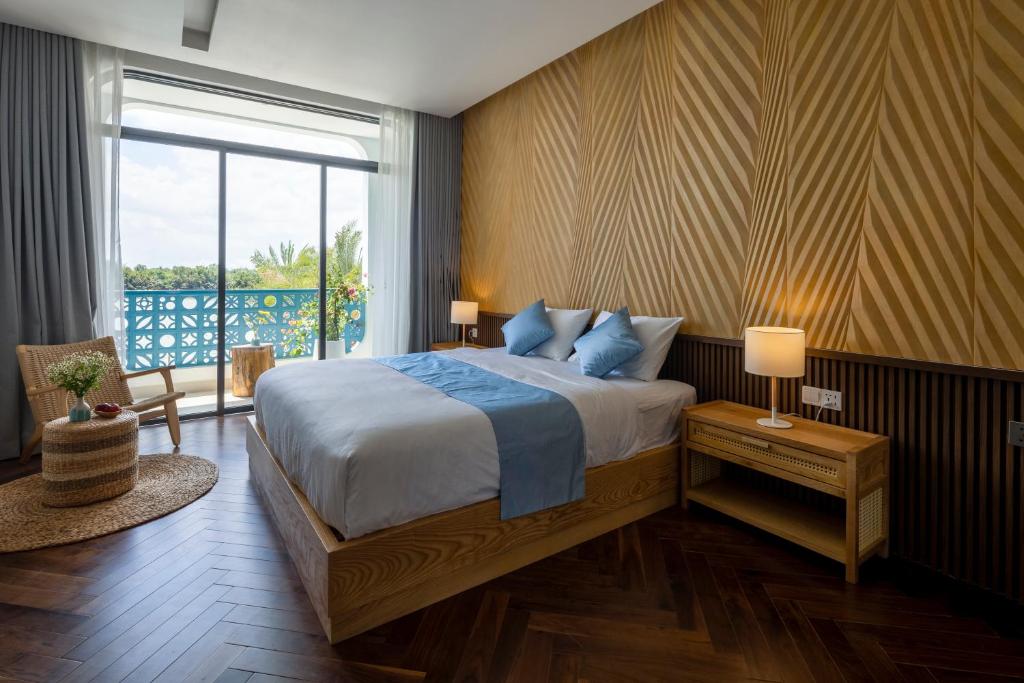 Postel nebo postele na pokoji v ubytování The Stay Saigon Riverfront