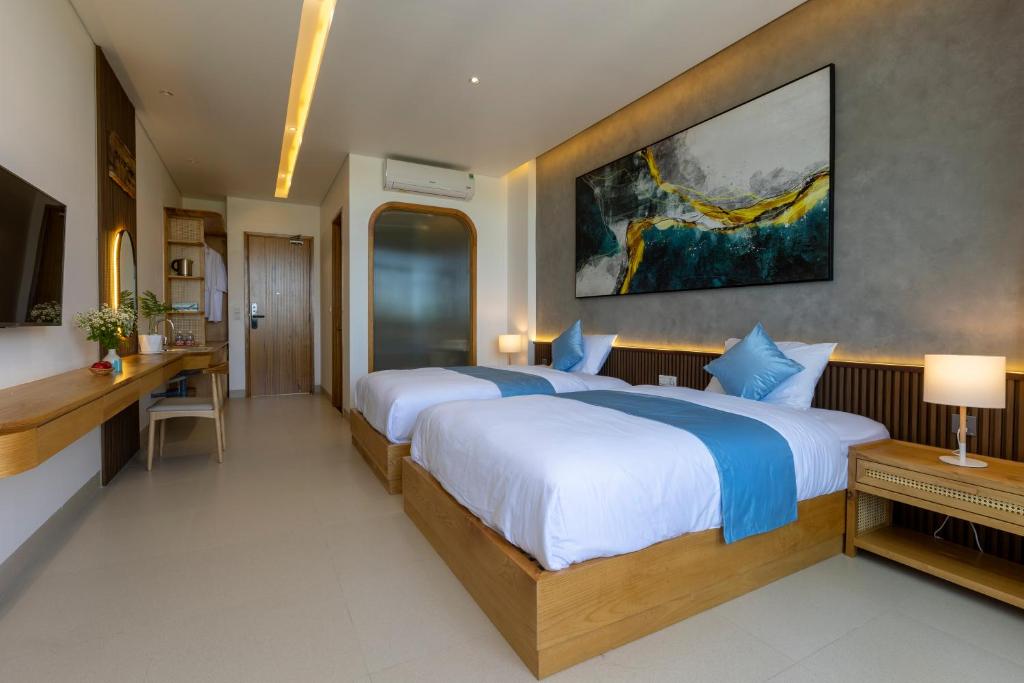 Postel nebo postele na pokoji v ubytování The Stay Saigon Riverfront