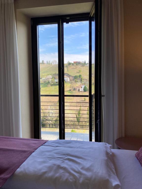 Postel nebo postele na pokoji v ubytování Cascina Bo