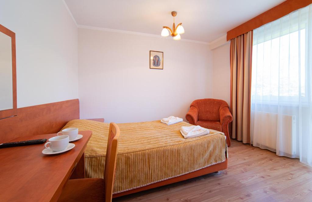 Postel nebo postele na pokoji v ubytování Ośrodek Wczasowy Dankar
