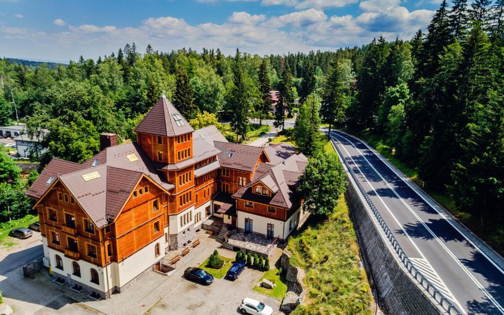 an aerial view of a large house with a road at Prywatne apartamenty z mini SPA, Sun & Snow in Szklarska Poręba