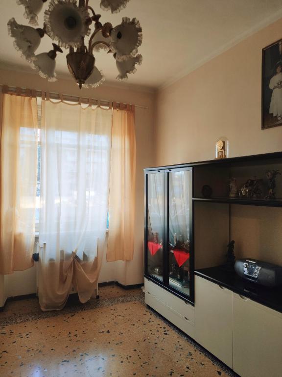 Televízia a/alebo spoločenská miestnosť v ubytovaní Appartamento ultra comodo -Torino