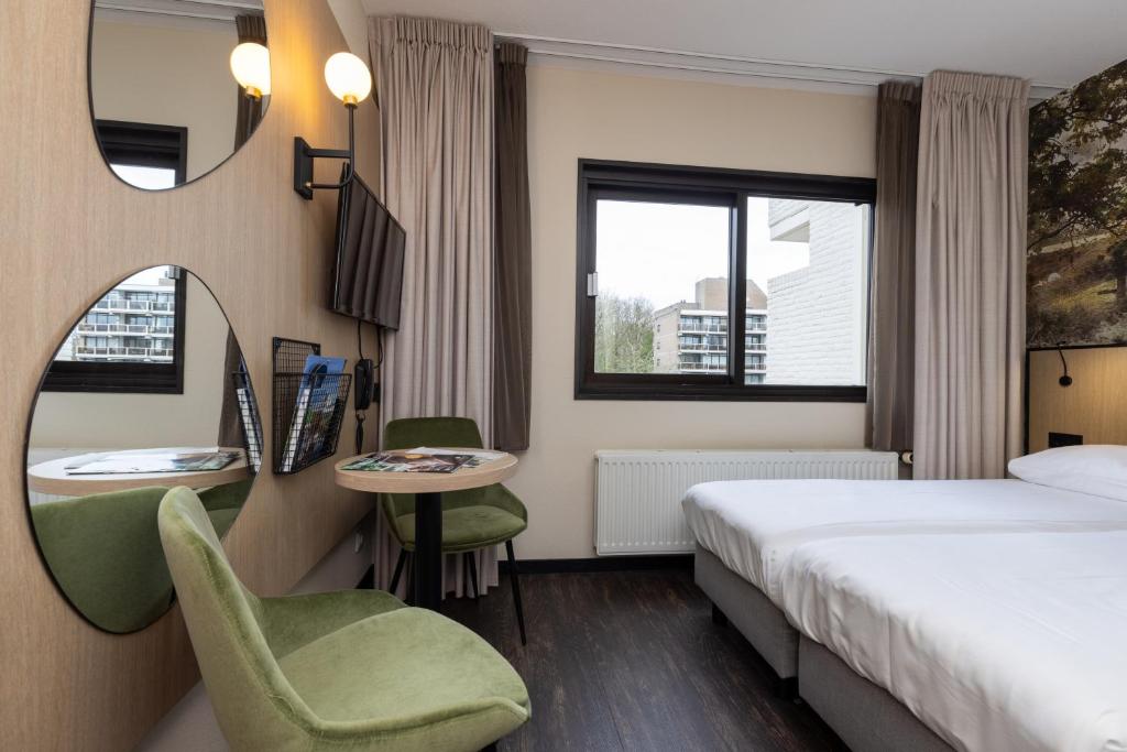 Postel nebo postele na pokoji v ubytování Fletcher Hotel-Restaurant Frerikshof