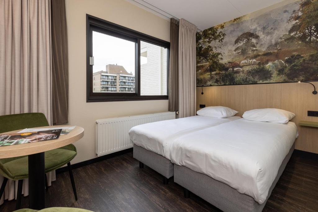 Postel nebo postele na pokoji v ubytování Fletcher Hotel-Restaurant Frerikshof