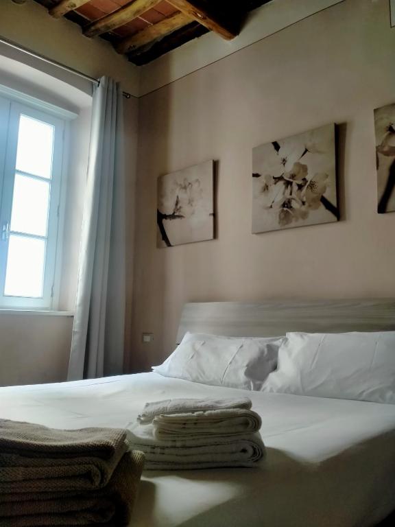 Postel nebo postele na pokoji v ubytování Casa Toscanella