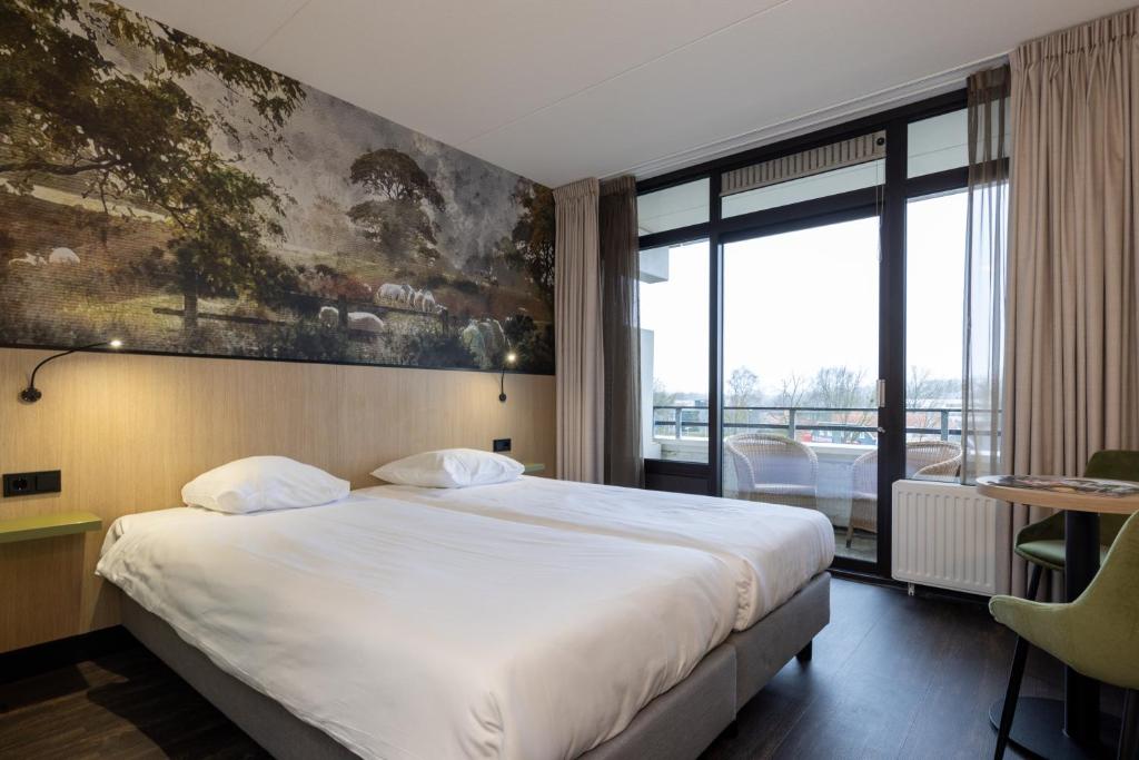 Postel nebo postele na pokoji v ubytování Fletcher Hotel-Restaurant Frerikshof