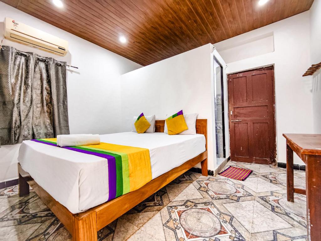 En eller flere senger på et rom på Hotel OakWood Baga