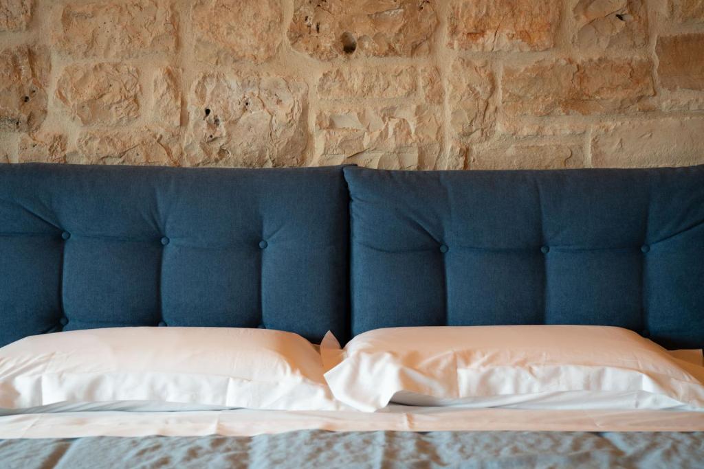 Postel nebo postele na pokoji v ubytování DONNAPAOLA MODERN FARM