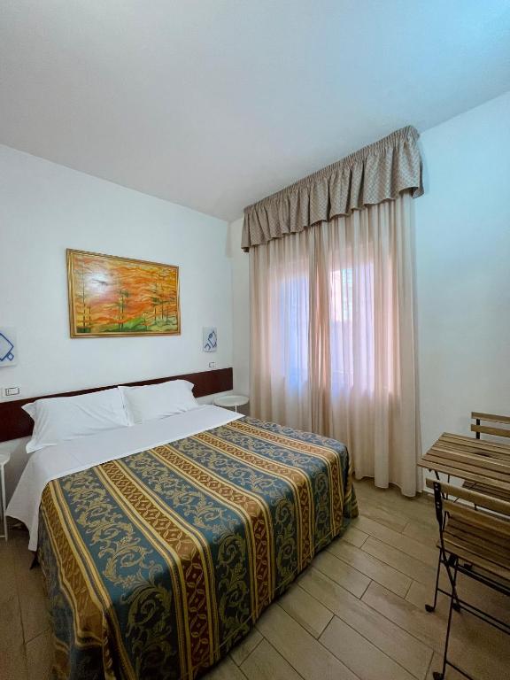 Postel nebo postele na pokoji v ubytování Hotel La Bussola