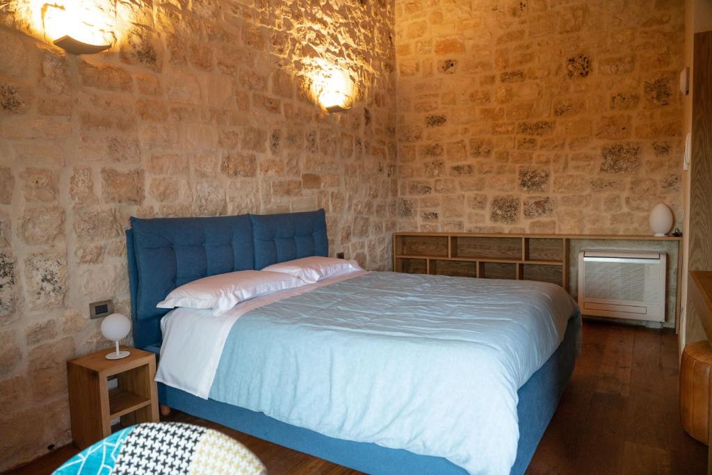 Postel nebo postele na pokoji v ubytování DONNAPAOLA MODERN FARM