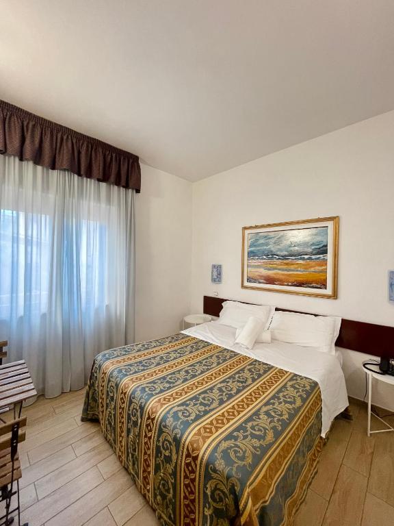 Postel nebo postele na pokoji v ubytování Hotel La Bussola
