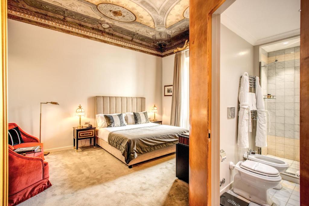 Postel nebo postele na pokoji v ubytování Martius Private Suites Hotel