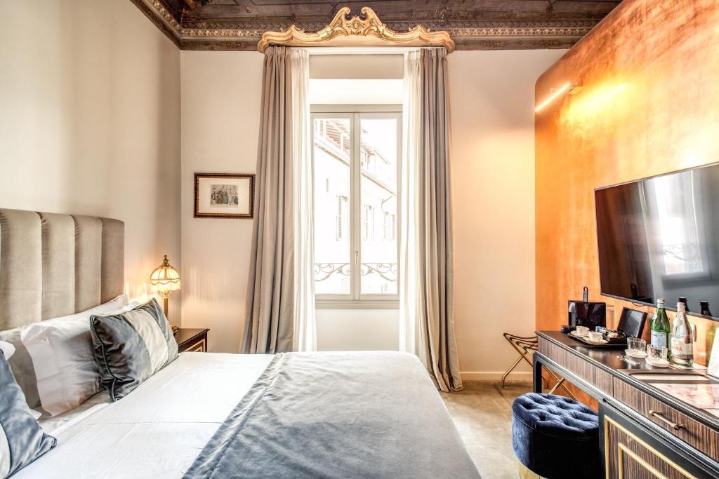 Postel nebo postele na pokoji v ubytování Martius Private Suites Hotel