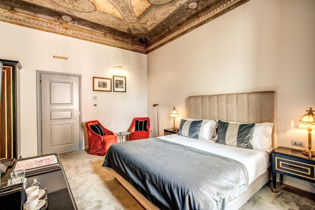 Postel nebo postele na pokoji v ubytování Martius Private Suites Hotel