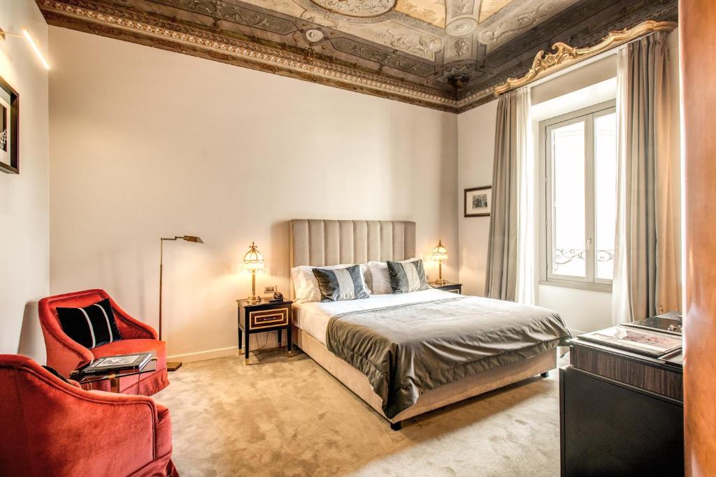 Postel nebo postele na pokoji v ubytování Martius Private Suites Hotel