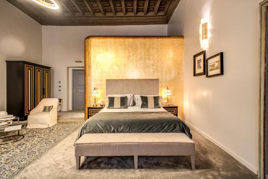 Postel nebo postele na pokoji v ubytování Martius Private Suites Hotel