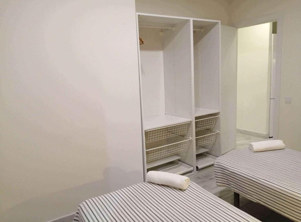 Posteľ alebo postele v izbe v ubytovaní Diagonal Apartments