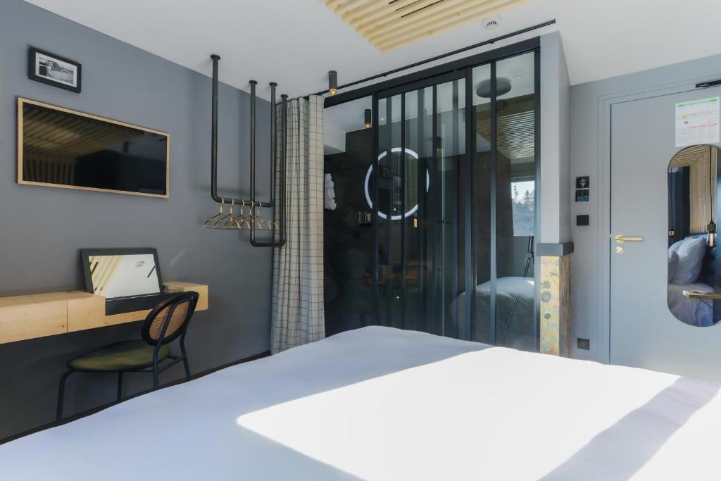 Postel nebo postele na pokoji v ubytování Savy Hôtel