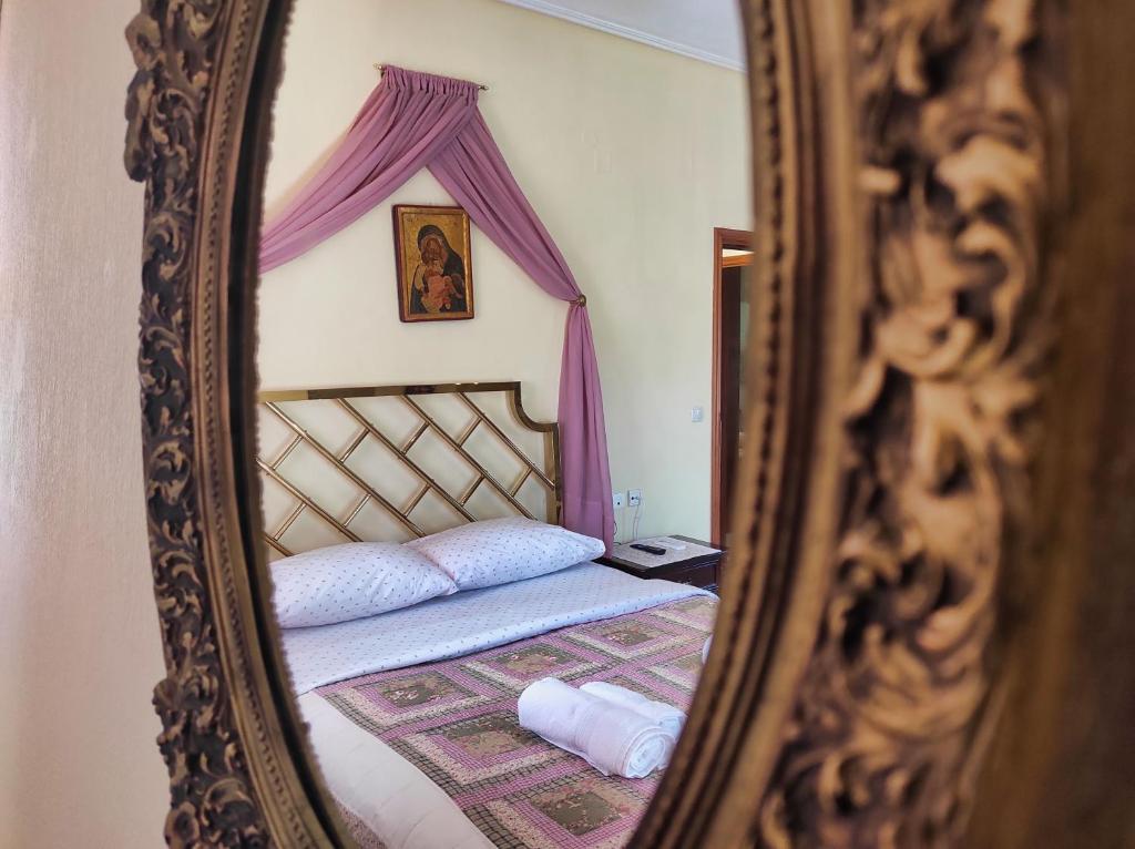 A bed or beds in a room at NATURE GUEST HOUSE KASTRAKI