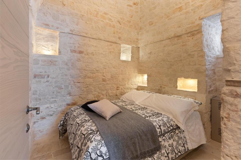 Posteľ alebo postele v izbe v ubytovaní Suite21 - The Trulli Experience