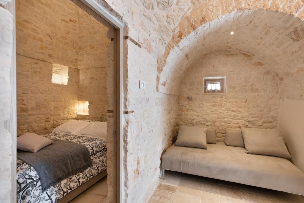 Posteľ alebo postele v izbe v ubytovaní Suite21 - The Trulli Experience