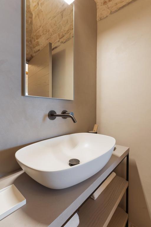 Kúpeľňa v ubytovaní Suite21 - The Trulli Experience