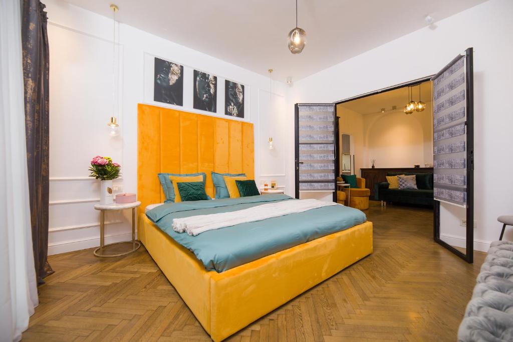 En eller flere senge i et værelse på Bucharest Central Apartment Inter