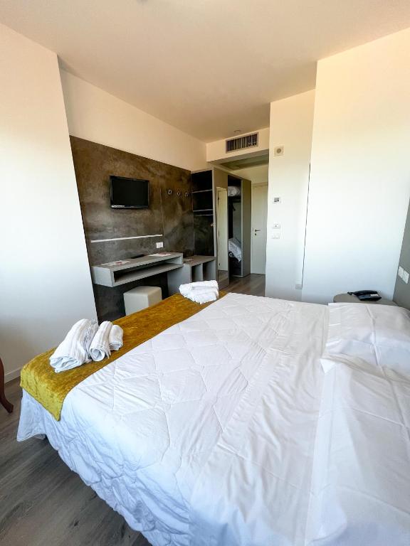 Postel nebo postele na pokoji v ubytování Hotel Joli