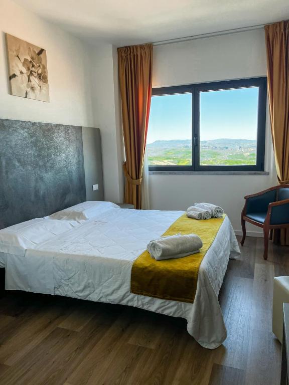 Postel nebo postele na pokoji v ubytování Hotel Joli